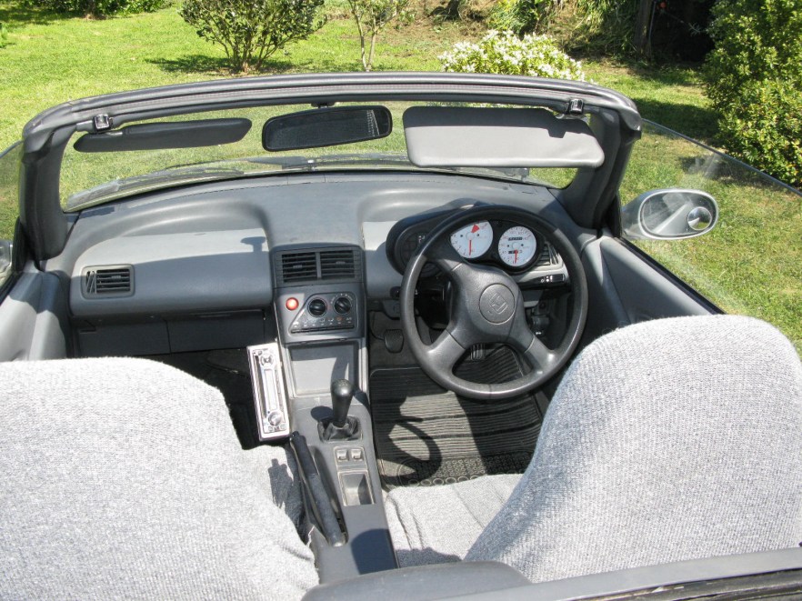 View of the cabin with the top down from behind the seats.